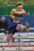 Charlotte Buckingham hurdling for the senior team at Ellesmere Port in May