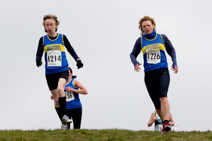 Sue Cooper and Michelle Spencer crest the hill at Beacon Park in Mid Lancs XC